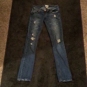 Garage destroyed paint splatter skinny jeans